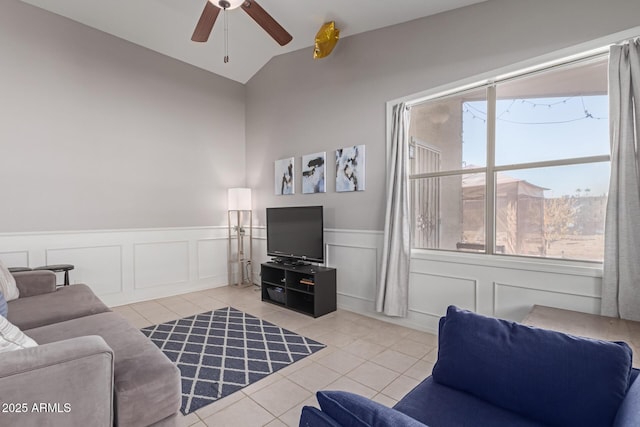 tiled living room with vaulted ceiling and ceiling fan