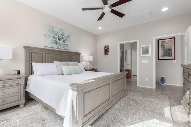 tiled bedroom featuring ceiling fan and connected bathroom