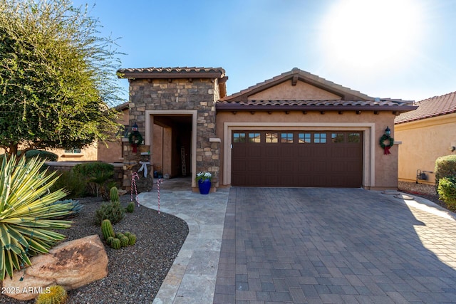 mediterranean / spanish-style home with a garage