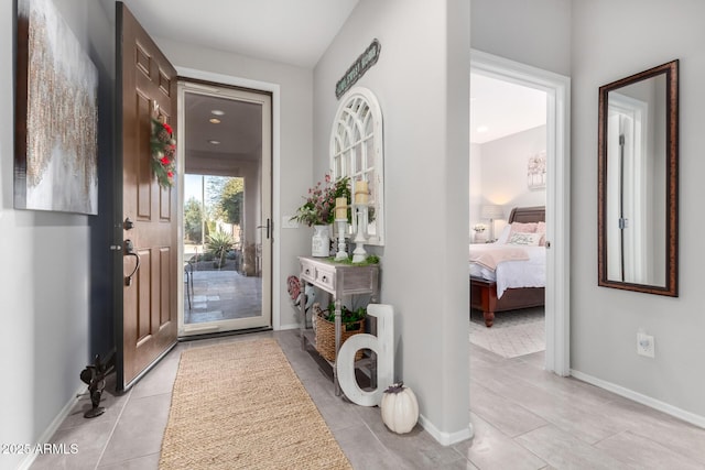 entryway featuring light tile patterned floors