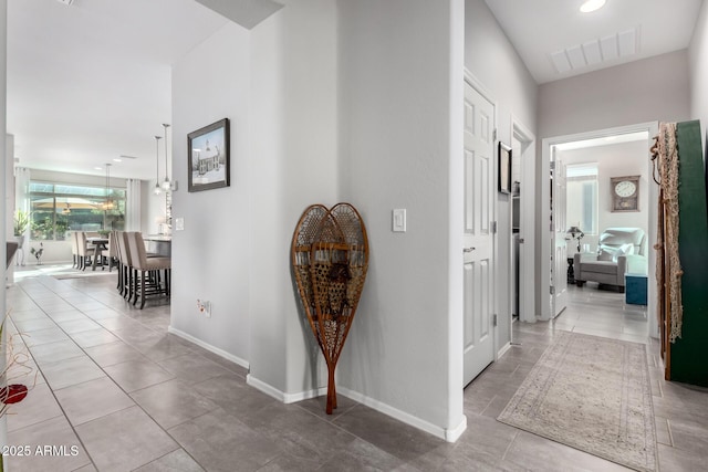 hall featuring tile patterned floors