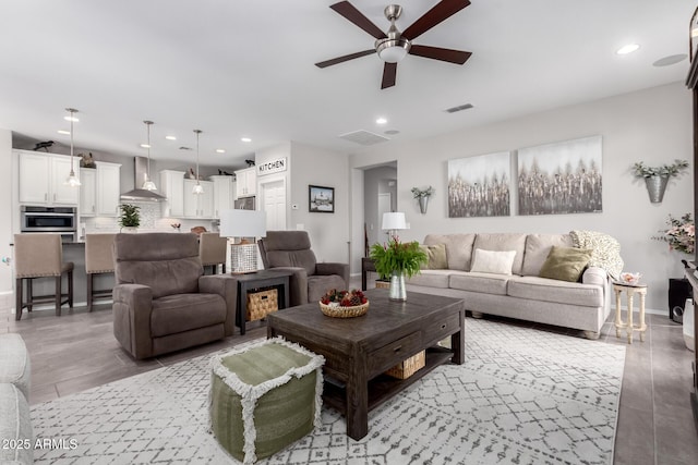 living room featuring ceiling fan