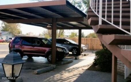 view of parking / parking lot with fence