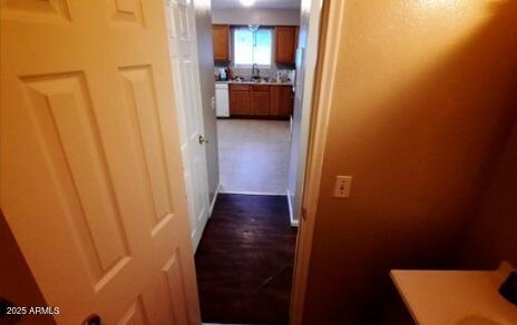 hallway featuring a sink