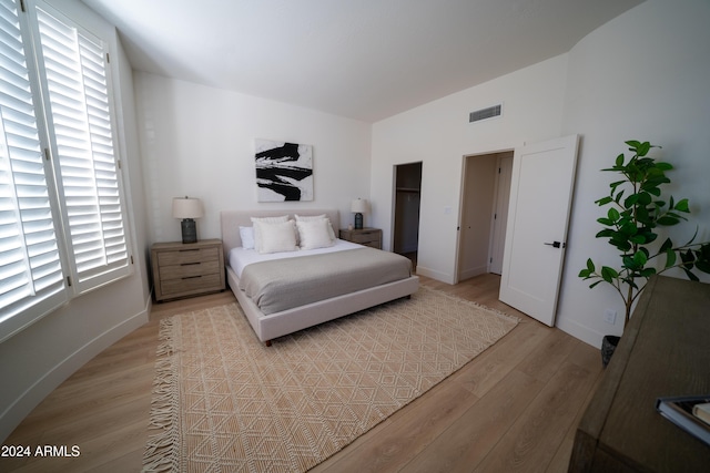 bedroom with light hardwood / wood-style floors