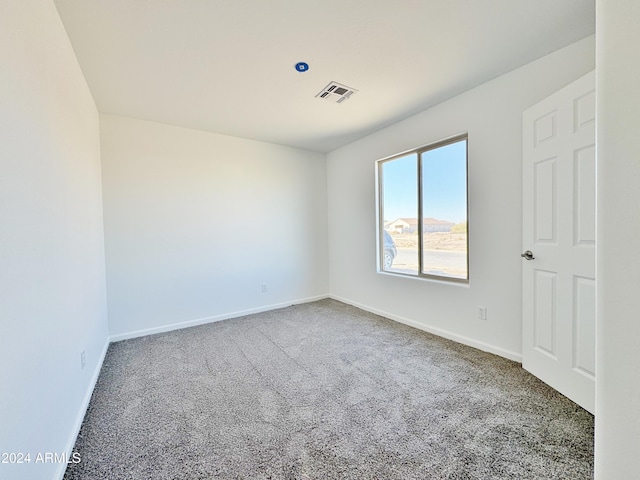 empty room featuring carpet flooring