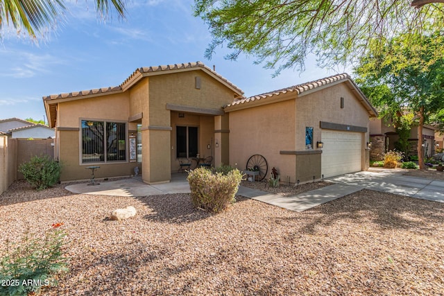 839 E Leo Pl, Chandler, AZ 85249 - mediterranean / spanish home with stucco siding, an attached garage, a tile roof, and driveway