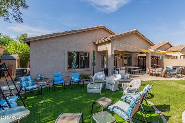 839 E Leo Pl, Chandler, AZ 85249 - rear view of house with outdoor lounge area, cooling unit, stucco siding, and a lawn