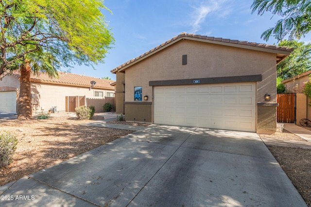 839 E Leo Pl, Chandler, AZ 85249 - view of front of home featuring stucco siding, a tile roof, and driveway