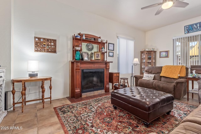 839 E Leo Pl, Chandler, AZ 85249 - living area with a glass covered fireplace, a ceiling fan, and healthy amount of natural light