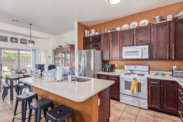 839 E Leo Pl, Chandler, AZ 85249 - kitchen with white appliances, a sink, light tile patterned flooring, light countertops, and pendant lighting