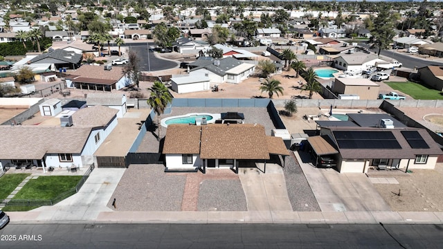 birds eye view of property with a residential view