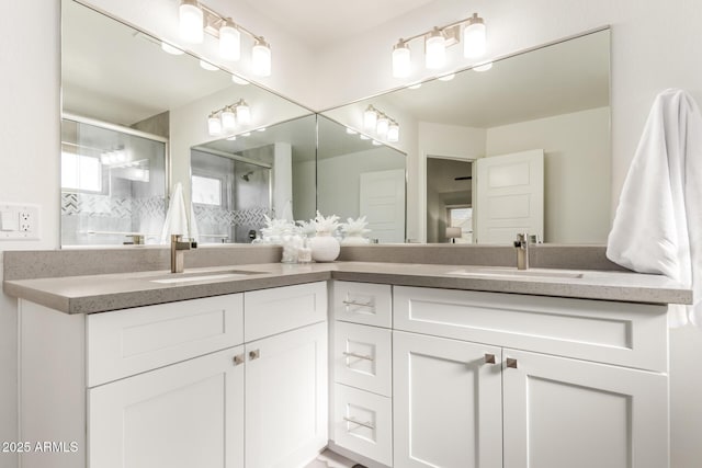 bathroom featuring vanity and an enclosed shower