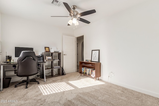 office featuring ceiling fan and light carpet