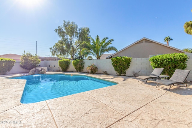 view of swimming pool featuring a patio area and pool water feature