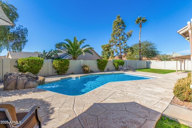 view of pool featuring pool water feature and a patio area