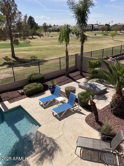 view of pool with a yard and a patio area