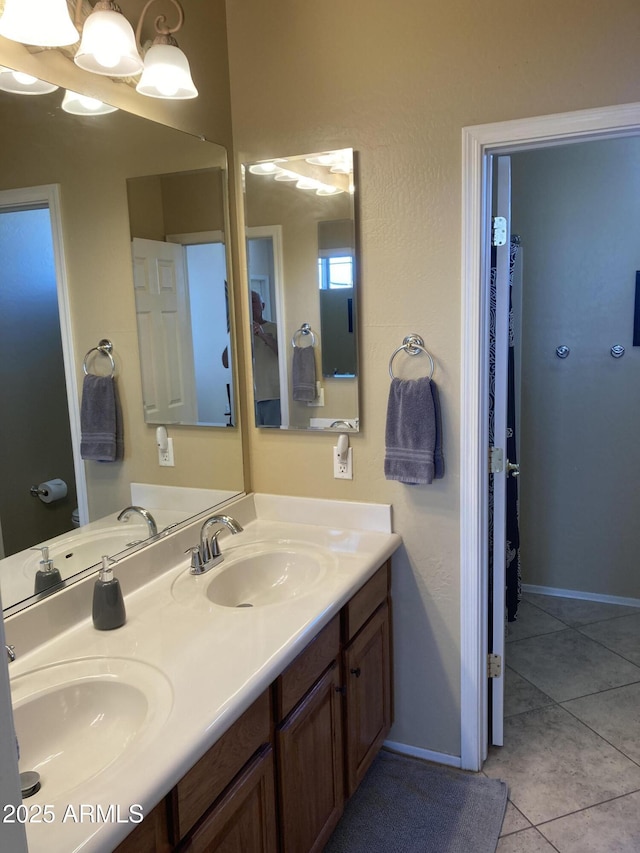 bathroom featuring tile patterned flooring and vanity