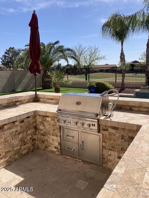 view of patio / terrace with area for grilling and exterior kitchen