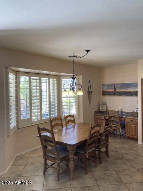 dining space with tile patterned floors