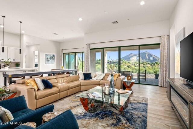 living room with light hardwood / wood-style flooring