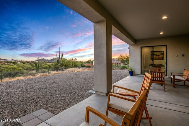 view of patio terrace at dusk