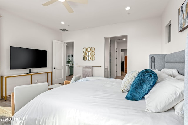 bedroom with ceiling fan and hardwood / wood-style floors