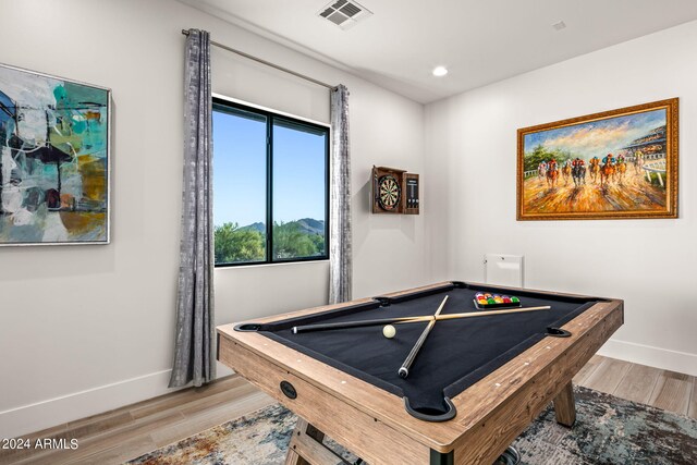 game room with wood-type flooring and billiards