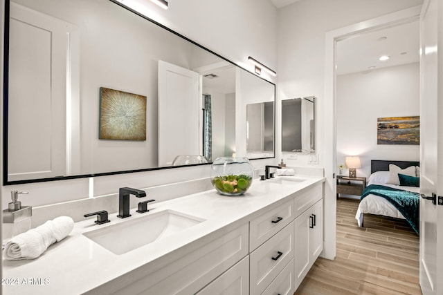 bathroom with vanity and hardwood / wood-style floors