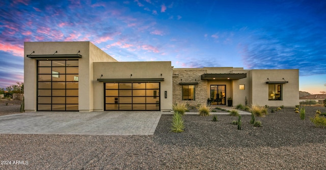 southwest-style home with a garage