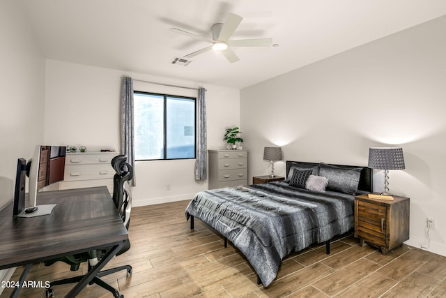 bedroom featuring hardwood / wood-style flooring and ceiling fan