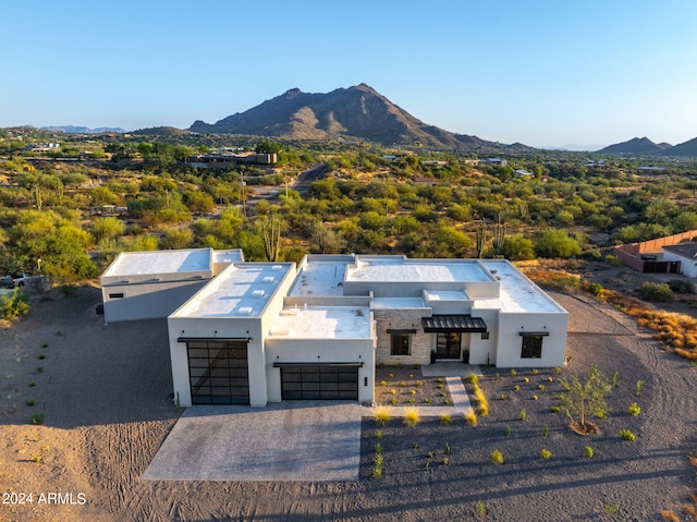 birds eye view of property with a mountain view