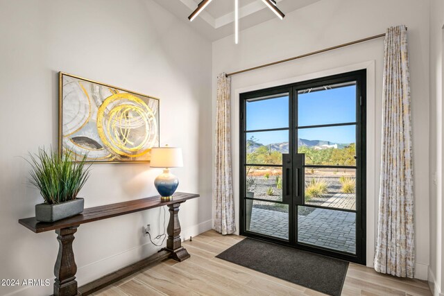 doorway to outside featuring french doors, a mountain view, and light hardwood / wood-style flooring