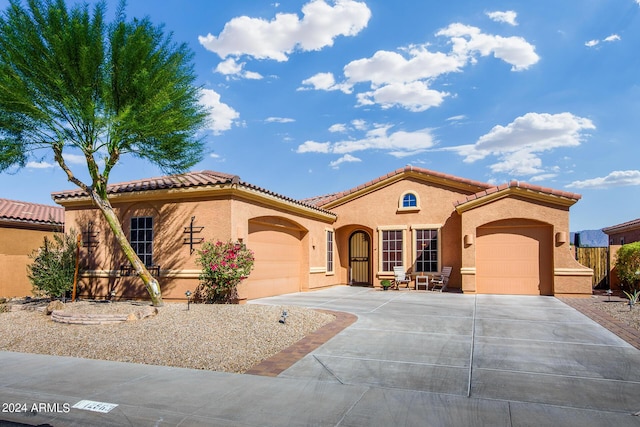 mediterranean / spanish house featuring a garage