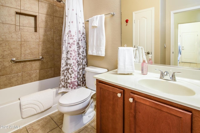 full bathroom with tile patterned floors, toilet, shower / tub combo, and vanity