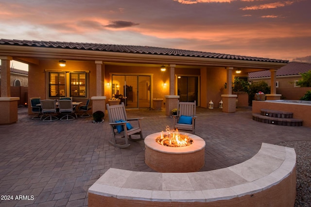 patio terrace at dusk with an outdoor fire pit