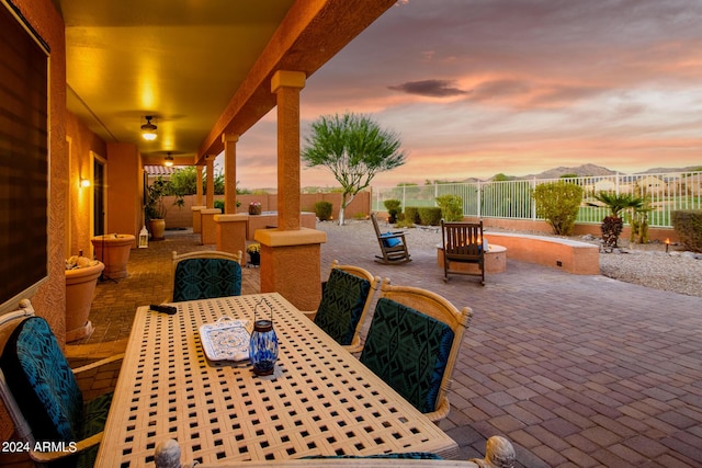 view of patio terrace at dusk