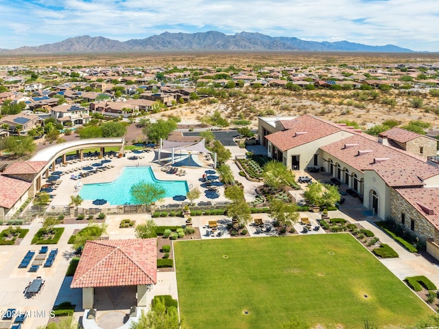 birds eye view of property featuring a mountain view