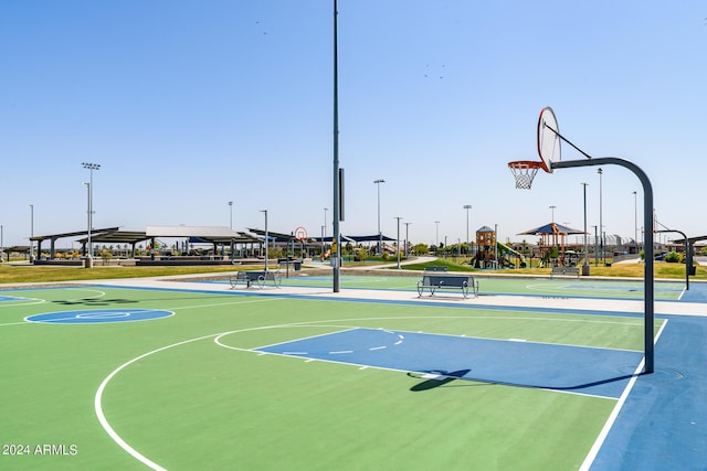 view of sport court featuring a playground