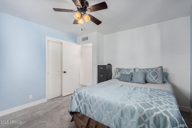 carpeted bedroom with a closet and ceiling fan