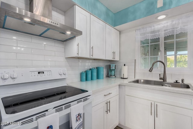 kitchen with electric range, ventilation hood, sink, white cabinets, and decorative backsplash