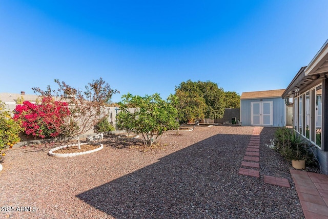 view of yard with a storage shed