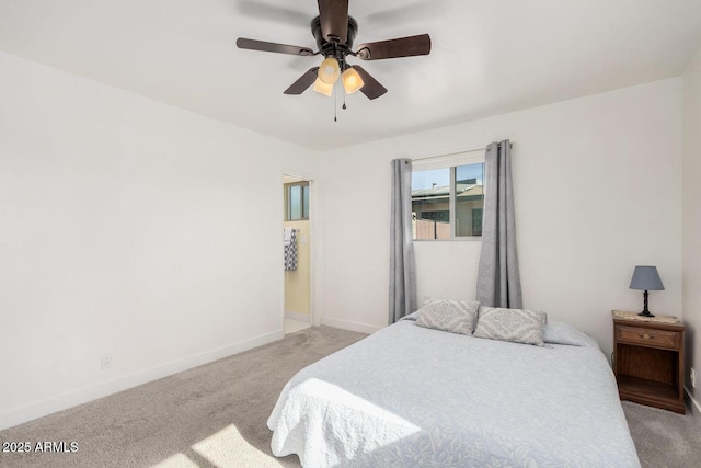 bedroom with light carpet and ceiling fan