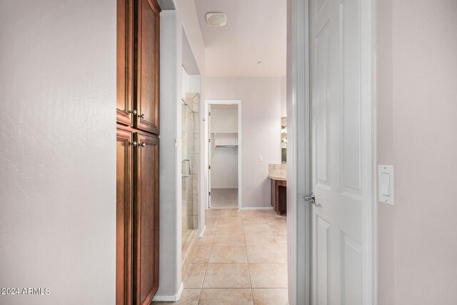 hall featuring light tile patterned flooring