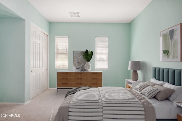 carpeted bedroom featuring a closet