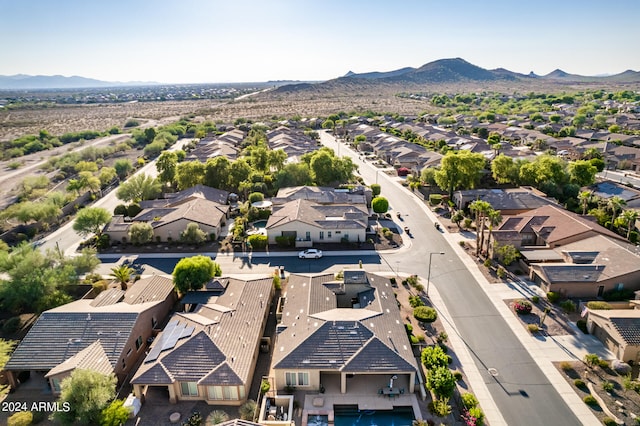 birds eye view of property with a mountain view