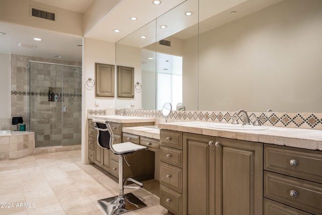 bathroom with walk in shower, vanity, and tile patterned flooring