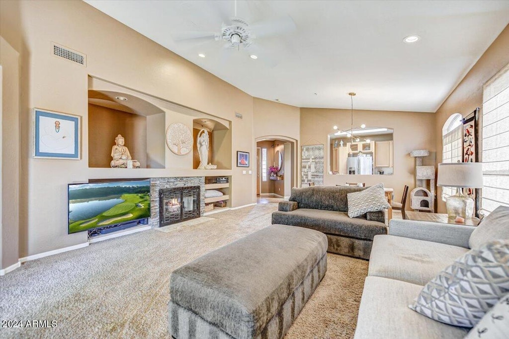 17900 N 80th Pl, Scottsdale, AZ 85255 - carpeted living area with arched walkways, ceiling fan, a stone fireplace, baseboards, and recessed lighting