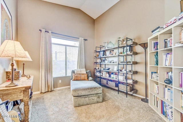 sitting room with carpet and lofted ceiling