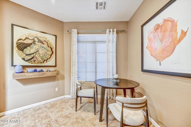 tiled dining room featuring a wealth of natural light